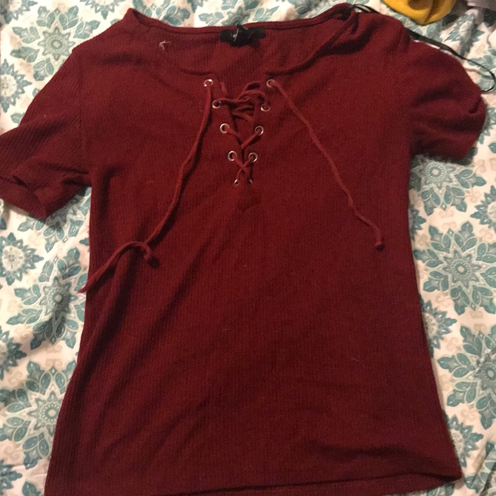 A all red shirt with strings that you could tie